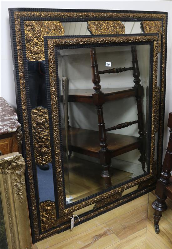 A 19th century Flemish ebonised and gilt metal-mounted wall mirror W.103cm